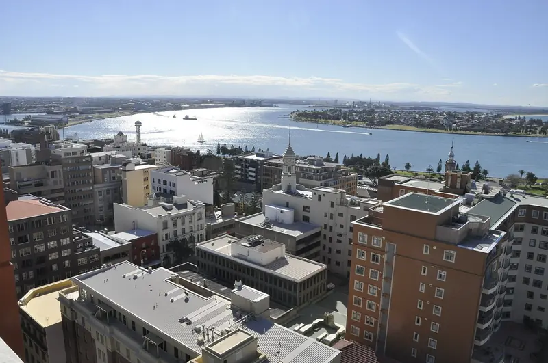 Newcastle Harbour and the city centre, seen from above the Hunter River mouth.