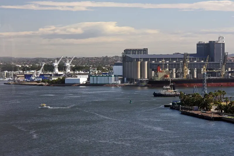 Newcastle Harbour's working waterfront, the commercial port infrastructure behind the club's superyacht pitch.
