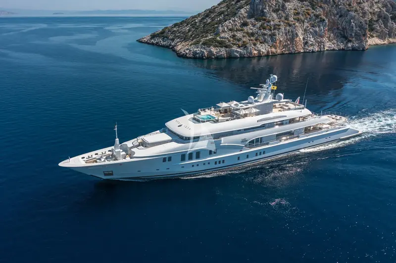 An aerial view of Lady Vera cruising, showing her full profile and helipad forward of the bridge.