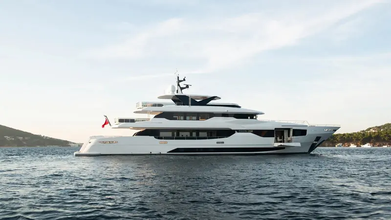 Orion One's near-vertical bow and flared hull sides, a profile shared with the Fraser brokerage listing photography.