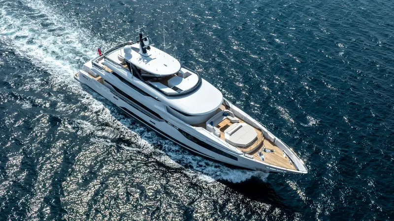 The bow from above, with the flared stem Red Yacht Design drew for the yard's debut hull. The foredeck sunpads and tender garage sit forward of a flybridge that carries the boat's only hot tub.
