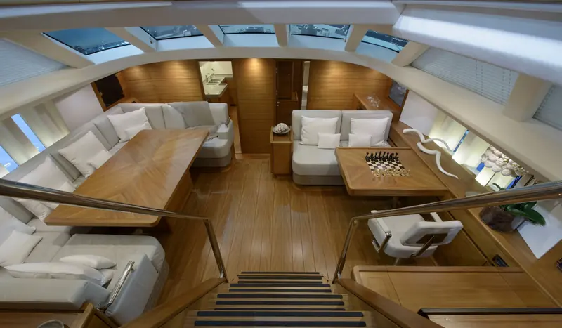 The saloon of an Oyster 825, seen from the companionway. The model's semi-custom interior is one reason the type carries a premium among owners planning long ocean passages.
