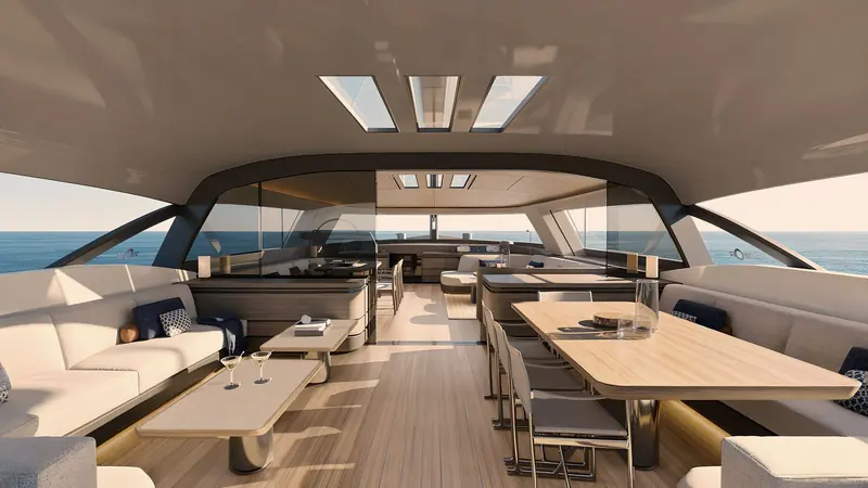 The main saloon, arranged on a single level with dining and lounge seating beneath a curved, heavily glazed superstructure.