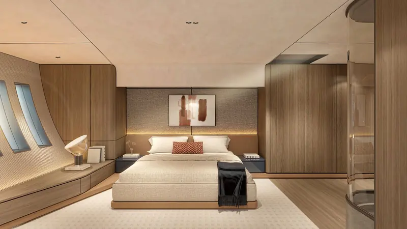 One of the yacht's staterooms, finished in warm wood tones with a private ensuite beyond.