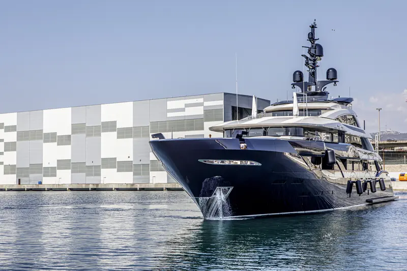 A yacht alongside at one of the network's facilities, the routine end of the lifecycle-support pitch: inspection and maintenance between refits, not just the refit itself.