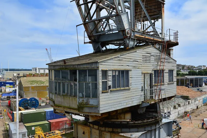 The cab of a 1954 Stothert and Pitt crane still standing on the dock. Falmouth's yard infrastructure is old, and replacing or repairing it is precisely the capital problem the docks redevelopment sets out to solve.