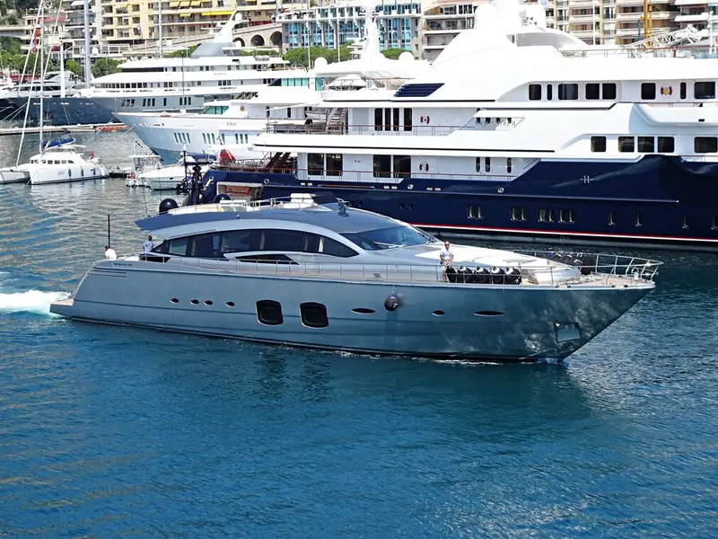 Grace departs Port Hercule in Monaco, dwarfed by the megayachts moored behind her - a reminder of the scale bracket she competes in at just under 33 metres.