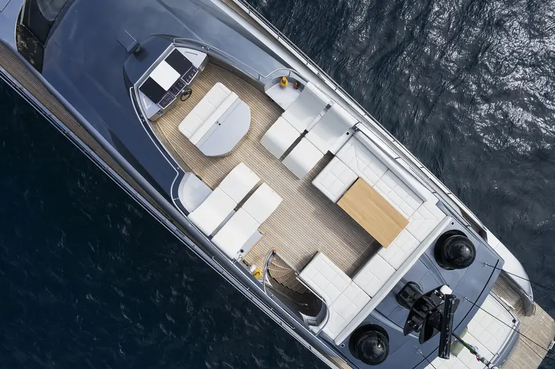 The flybridge seen from directly above, showing the helm station, sunpad and aft seating that make up Grace's open-air command deck.