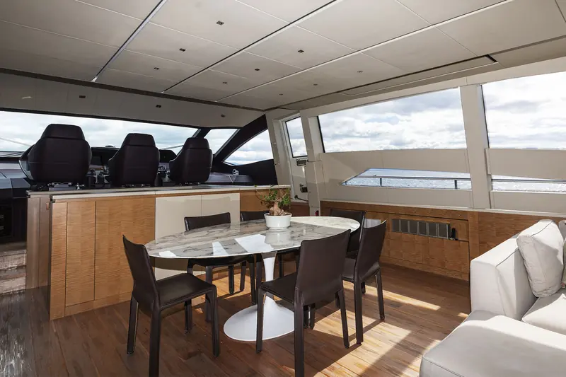 The dining area, part of a layout built for eight guests across four staterooms including a full-beam master.