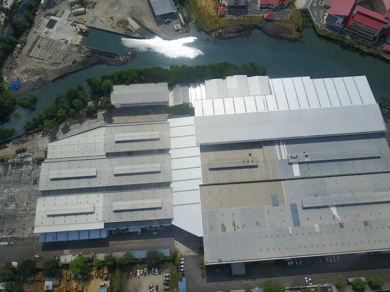 A used boat is surveyed wherever it lifts out, often nowhere near the yard that built it. Grand Banks Yachts' shipyard at Pasir Gudang, Malaysia, seen from above.
