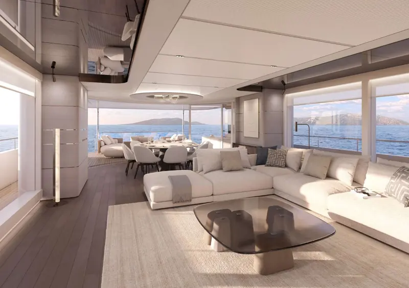 The main saloon render, opening directly onto the aft dining deck through full-height glass.