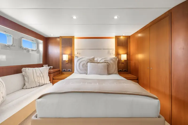 One of Alaia's five staterooms, finished during the 2022 refit with new joinery and soft furnishings throughout.