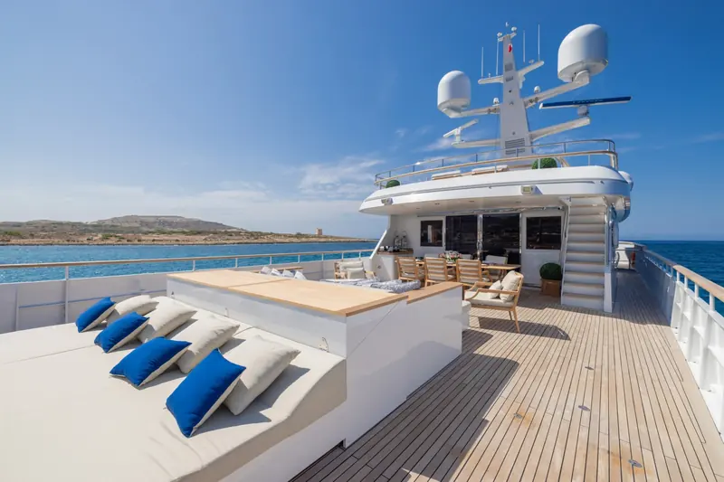 The sundeck and aft lounge seating, part of the Beach House-style open deck space added in the 2022 refit.