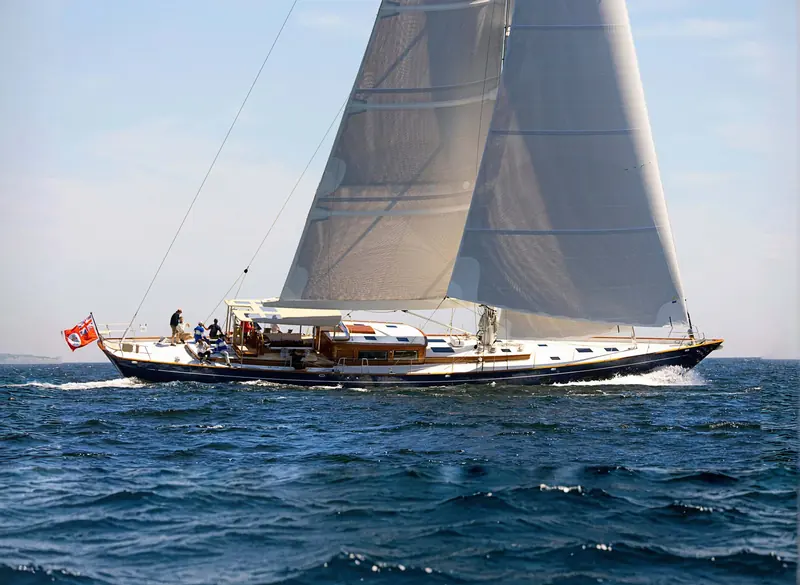 Underway on Penobscot Bay with genoa and mainsail both drawing, the Red Ensign flying aft.