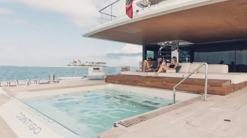 The lowered swim platform and pool aft, named on the transom coping, are where the fuel cell's payoff is felt most: near-silent hotel power at anchor, engines off.