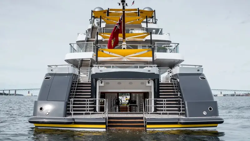 The transom and tender garage, lowered to beach-club mode, with the yacht's twin custom tenders stowed inside.