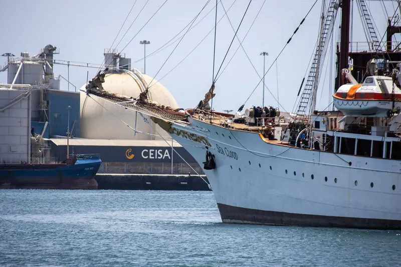 The gilded SEA CLOUD nameplate on her clipper bow, photographed at Las Palmas, Gran Canaria in July 2021 - the lettering the rebuild is restoring around.
