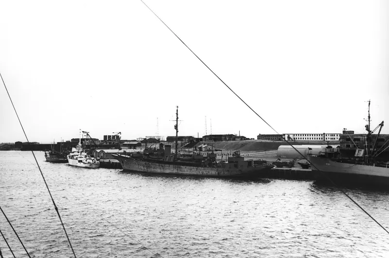 USS Sea Cloud (IX-99) at Argentia, Newfoundland in July 1944, serving with a Coast Guard crew on North Atlantic weather-reporting patrol during the Second World War.