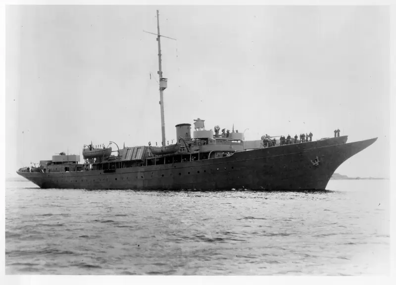 The USCGC Sea Cloud under way during her wartime Coast Guard service, stripped of her sailing rig and running as a powered weather ship.