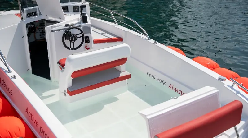 The helm console opened up on the demonstration RIB, showing the wiring a retrofit or new-build installation has to route.