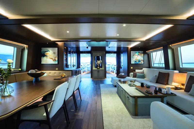 Looking aft through the deckhouse toward the cockpit. Accommodation runs to 12 guests across 6 cabins, sized around an owner's use rather than a full charter roster.