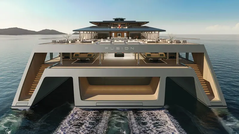 Fusion's stern, where the centre hull opens into a concealed beach club and the side hulls carry stairways down to the waterline.