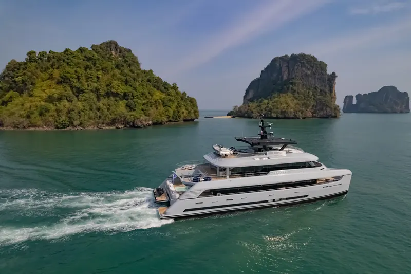 SpaceCat cruising past limestone islands off Thailand, where she ran an active charter programme through the sale process.