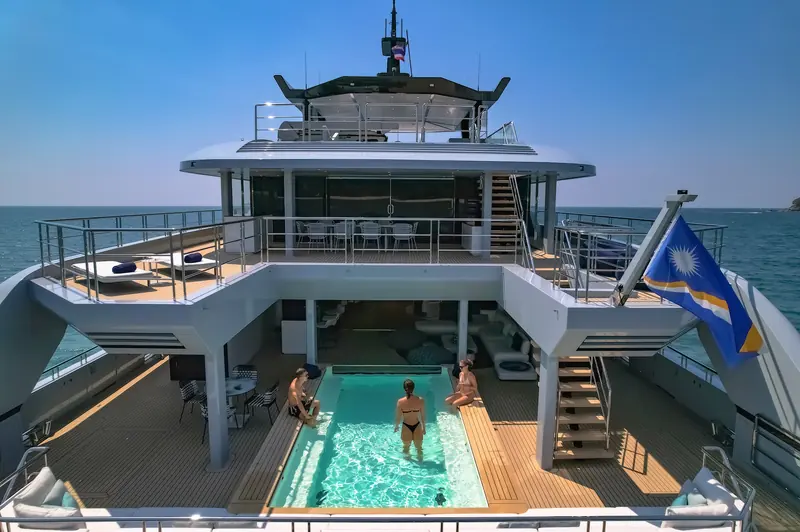 The aft pool deck - SpaceCat's 5.5-metre, 10,000-litre pool, one of the features that turned a niche catamaran into a recognisable set piece.