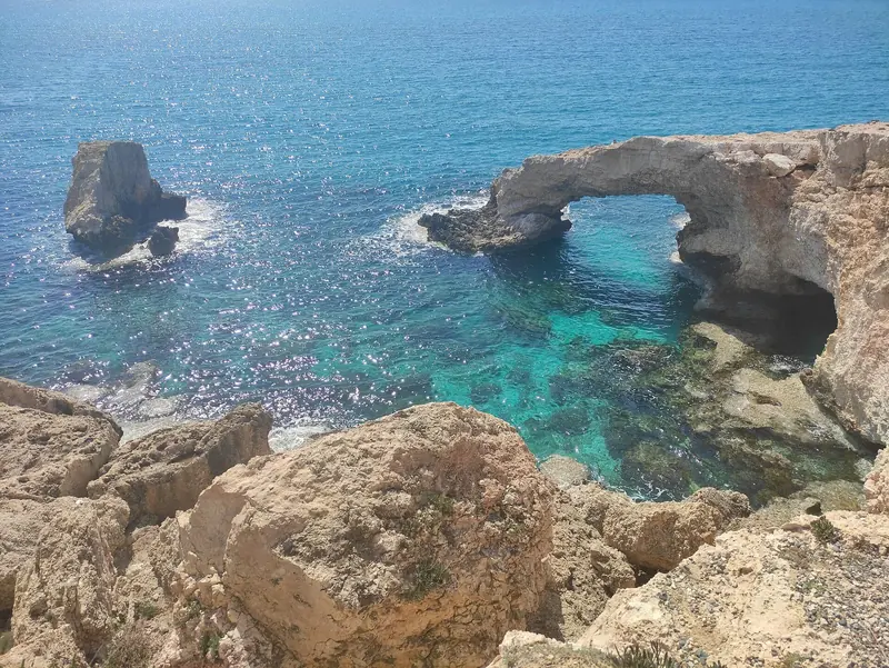 The Love Bridge sea arch at Cape Greco, part of the same rugged limestone coast where Perla Bianca and Petsas I were wrecked.