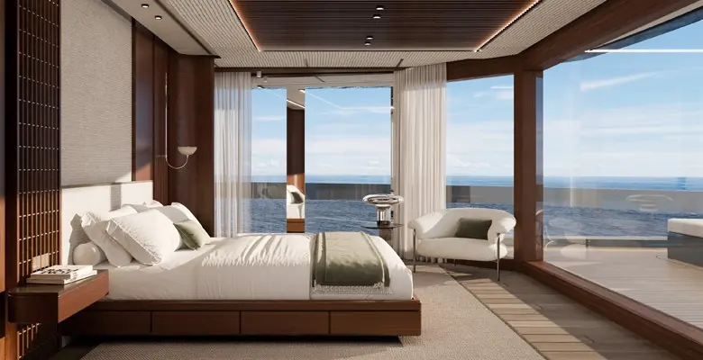 The owner's cabin, with full-height glazing opening onto the sea.
