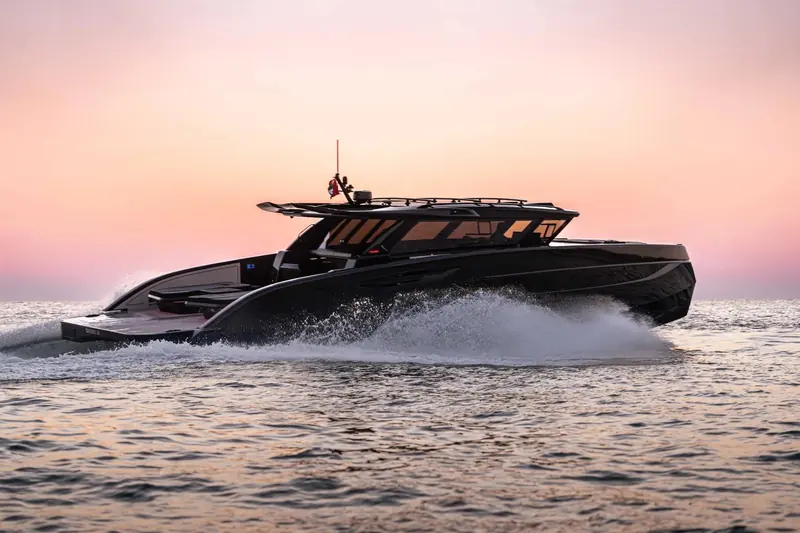 An 88 Ultima at speed at dusk. Sunreef's own spec sheet says 26 knots top speed; the one hull currently listed for sale carries smaller engines and a lower published max.