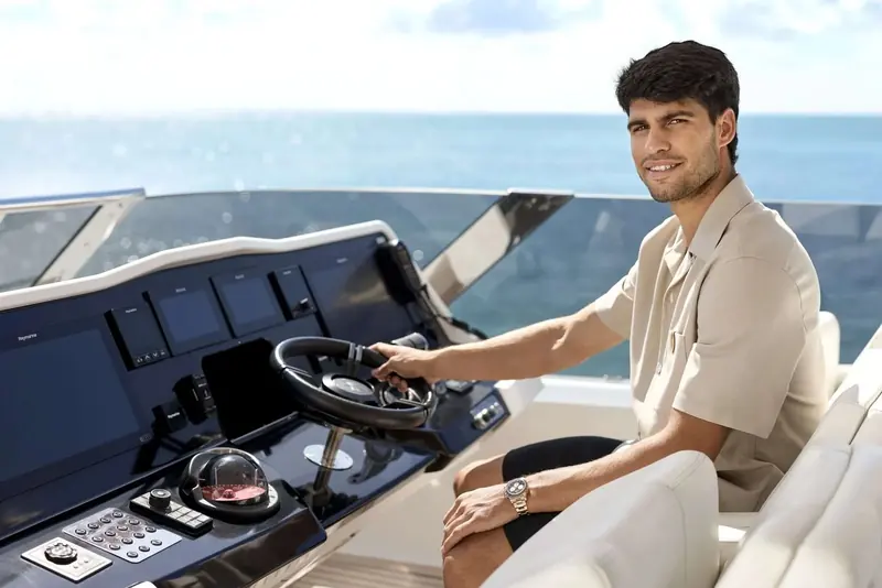 Carlos Alcaraz at the helm of his own 88 Ultima. Sunreef named him as an owner in March 2026; the yard's own release, not an independent report, is the only account of what he said about the choice.
