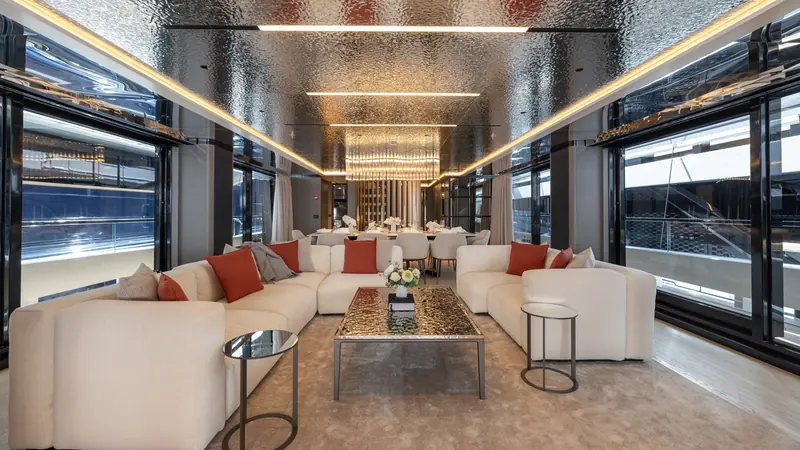 The main-deck lounge, part of an interior by Luca Dini Design & Architecture finished in oak with furniture from Cassina and Minotti.