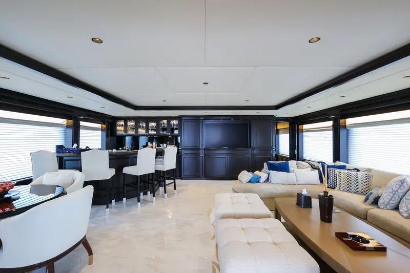 The bar, refinished in dark joinery, part of the interior work that ran alongside the paint and structural jobs Reviva says drove the schedule to 8.5 months.