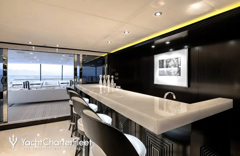 The bar, its black lacquer panelling and a Marilyn Monroe photographic print setting the Art Deco tone designer Carol Williamson gave the whole interior.