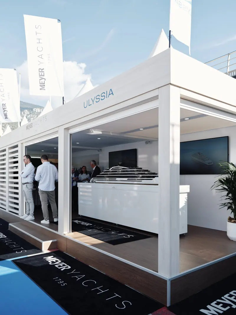 Ulyssia's presentation stand at an earlier show, still carrying Meyer Werft branding from when the German yard was the publicly named builder, before this week's switch to China Merchants Cruise Shipbuilding.