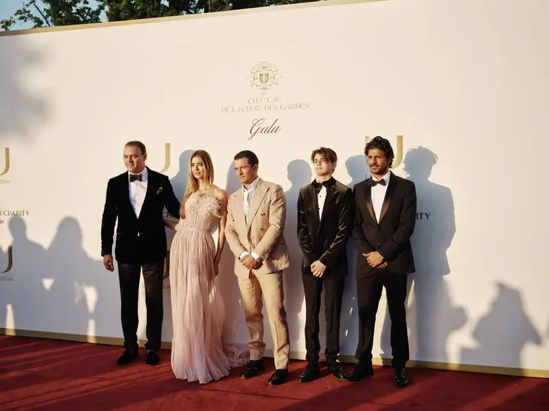 Guests on the red carpet at an Ulyssia-branded gala at Chateau de la Croix-des-Gardes, part of the project's Monaco-centred publicity push.