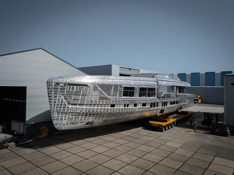 Back outside in daylight, the joined structure shows the long, low raised-pilothouse silhouette that Van der Valk drew for a 48m yacht.