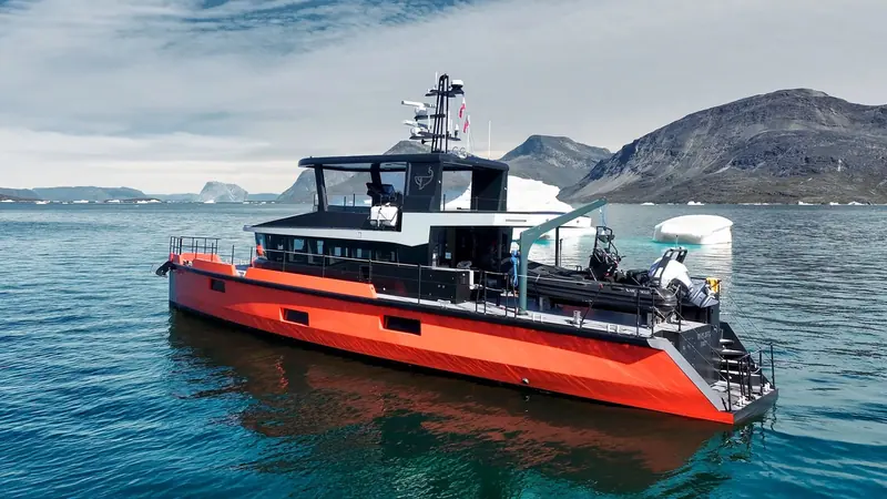 Vanguard among icebergs on her High Arctic transit. Naval Yachts built the 23.86-metre XPM 78 platform around an ice-reinforced hull and a diesel-electric Praxis hybrid system.