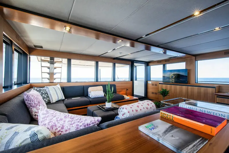 Casa's saloon, finished in warm woods with soft furnishings around the owner's suite and guest cabins.