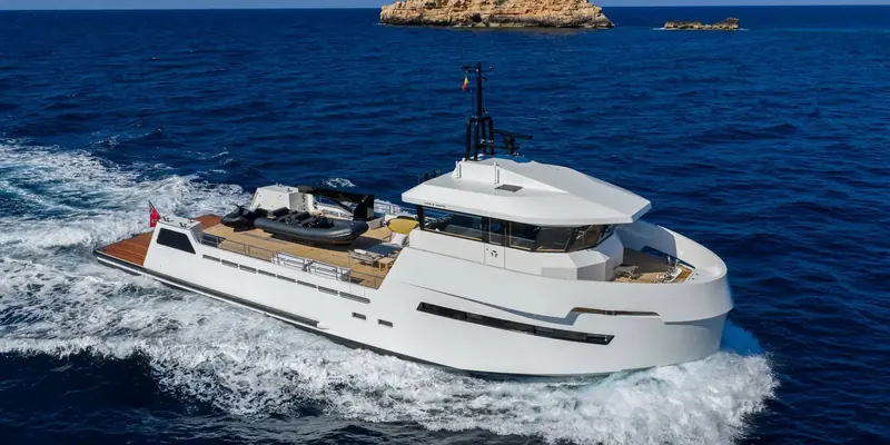 An aerial view of Playa's beach-club-style aft arrangement, built to carry tenders, toys and adventure equipment a primary yacht like Casa has no room for.