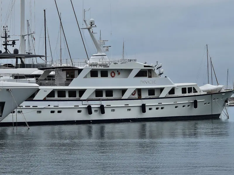 An explorer-style motor yacht at dock in Antibes. Trade press headlines that read 'new CA' or 'price cut' are usually two sides of the same story on boats like this.