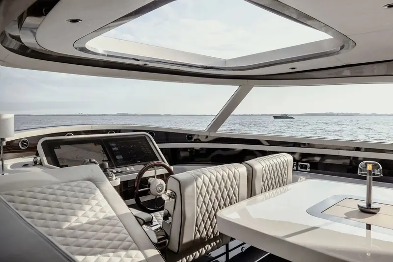 The wheelhouse, with the sunroof drawn back. Testers put the helm at 70 dBA at wide open throttle, quiet enough to hold a conversation at cruising speed.