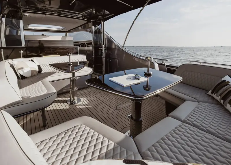 The cockpit table and aft seating. Reviewers rate this the boat's best space and its clearest purpose: entertaining at anchor rather than living aboard.