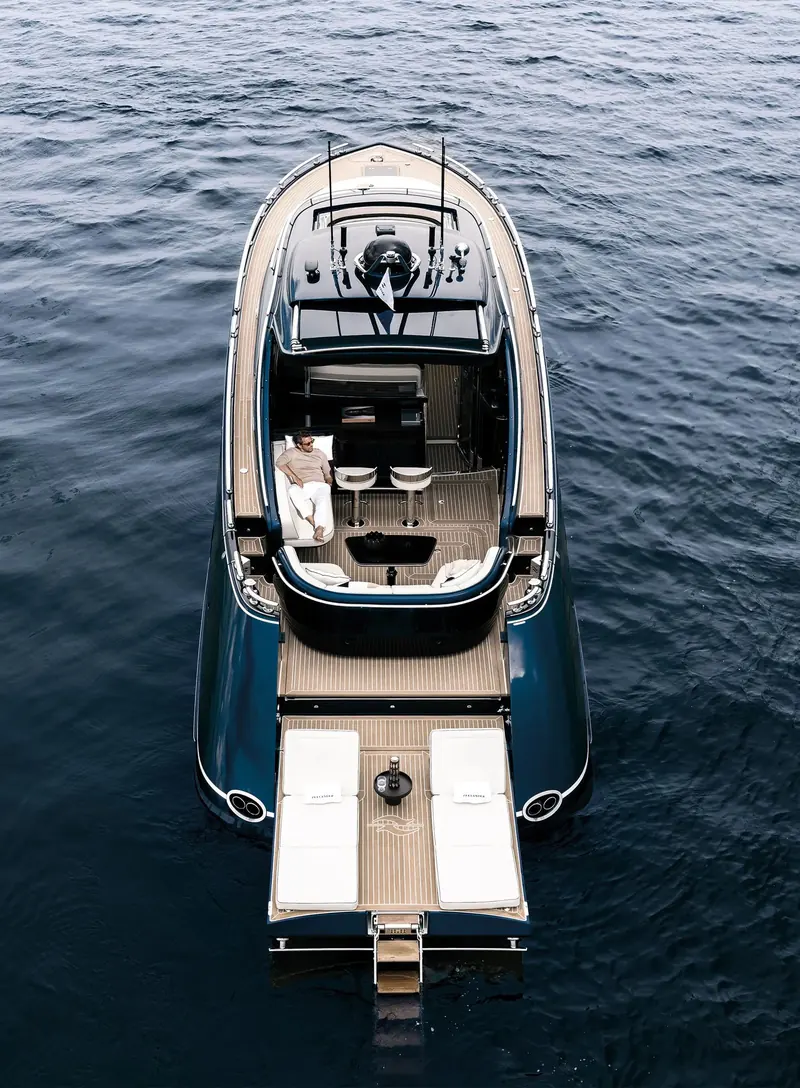 From astern with the platform deployed. Volvo Penta IPS pods sit under this floor, which is why a boat of this length manoeuvres on a joystick.