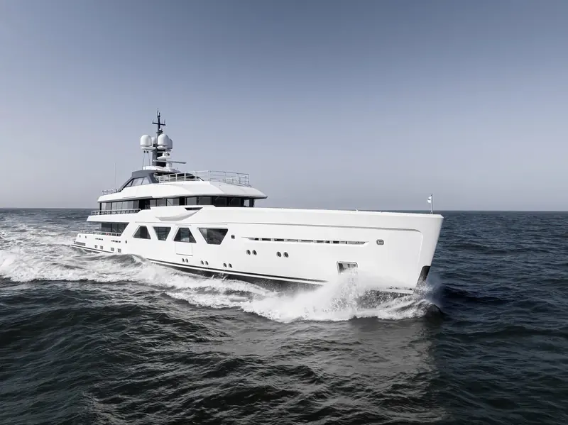 A new Amels 60 throws spray clear of the bow during sea trials, run out of Vlissingen before handover to her owner.