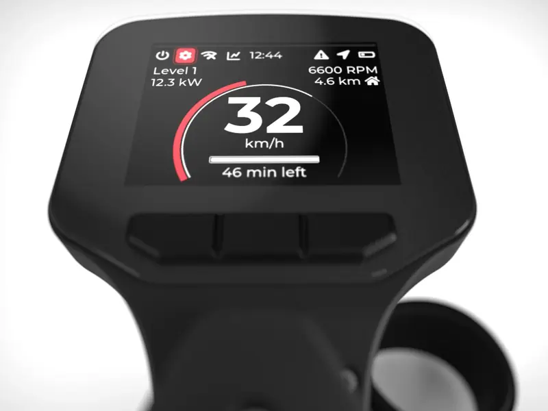 The handlebar display mid-ride, reading 32 km/h at Level 1 power, 12.3 kW draw, 6,600 rotor RPM and 46 minutes of range left.