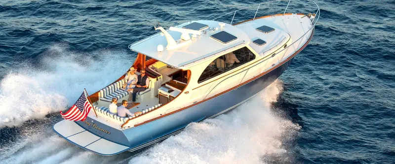 A Hinckley picnic boat underway on open water, finished in Awlgrip topside coating.