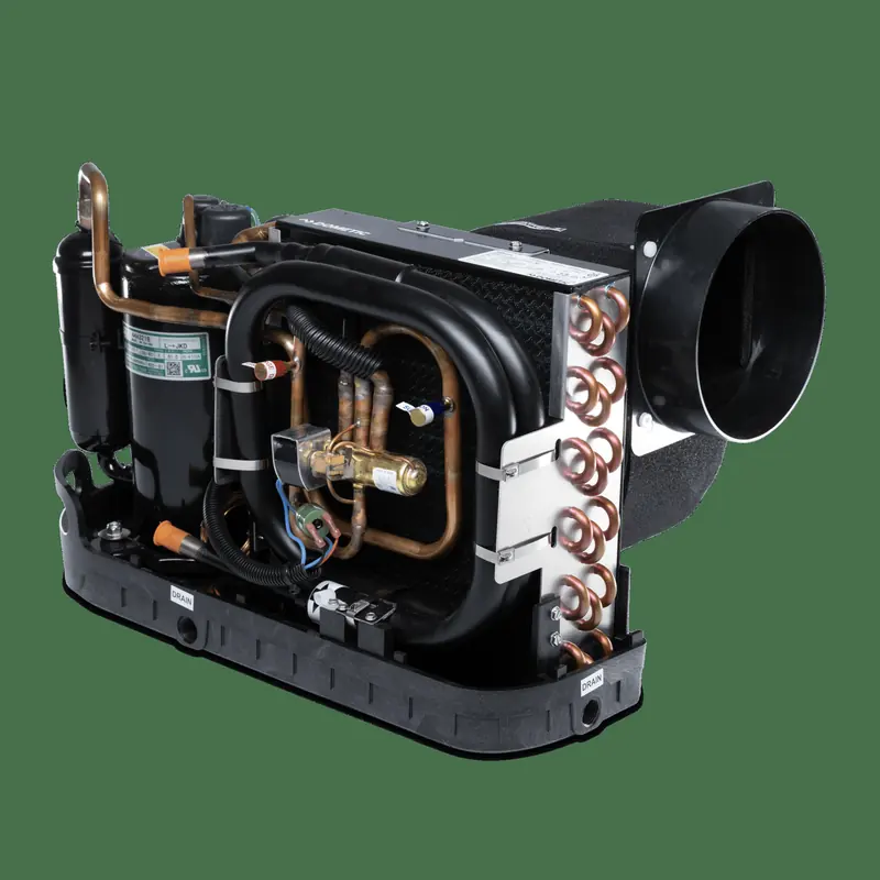 A Dometic Turbo GTX self-contained unit stripped to its chassis, compressor, raw-water condenser and blower housing all on one base.