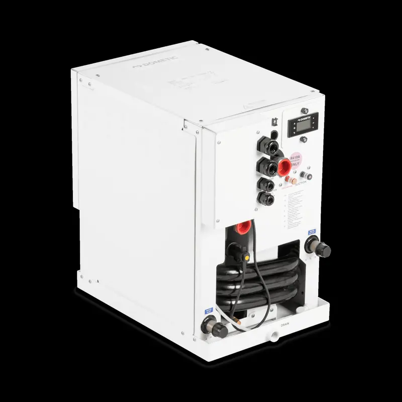 The chiller at the centre of a chilled-water system, mounted in the engine room and plumbed to seawater and to the fresh-water loop it cools.